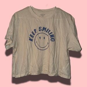 American Eagle Cropped Cream “Keep Smiling” Graphic Tee